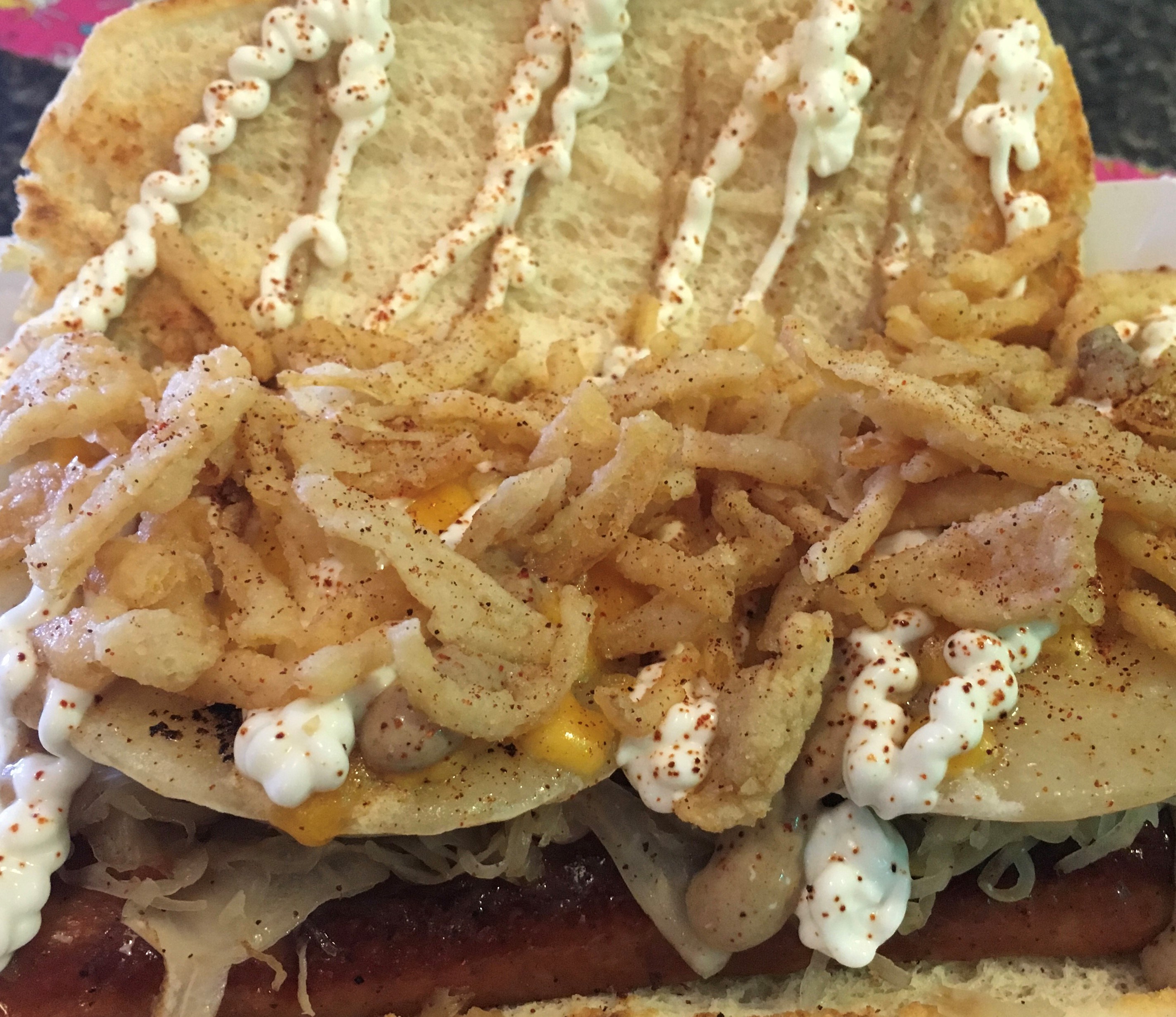 Pictured here: The Yinzer™ featuring Smith’s Andouille Sausage, Pierogis, Kraut, French Fried Onions, Melted Cheddar, Chipotle Seasoning, Stadium Mustard, Sour Cream. Vegetarian Option Available.
