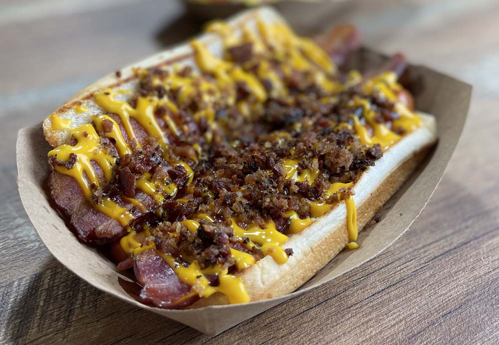 Lucky Louie’s Beer & Wieners Hog Dog with Bacon, Bacon, Bacon, Cheese Sauce and more Bacon.